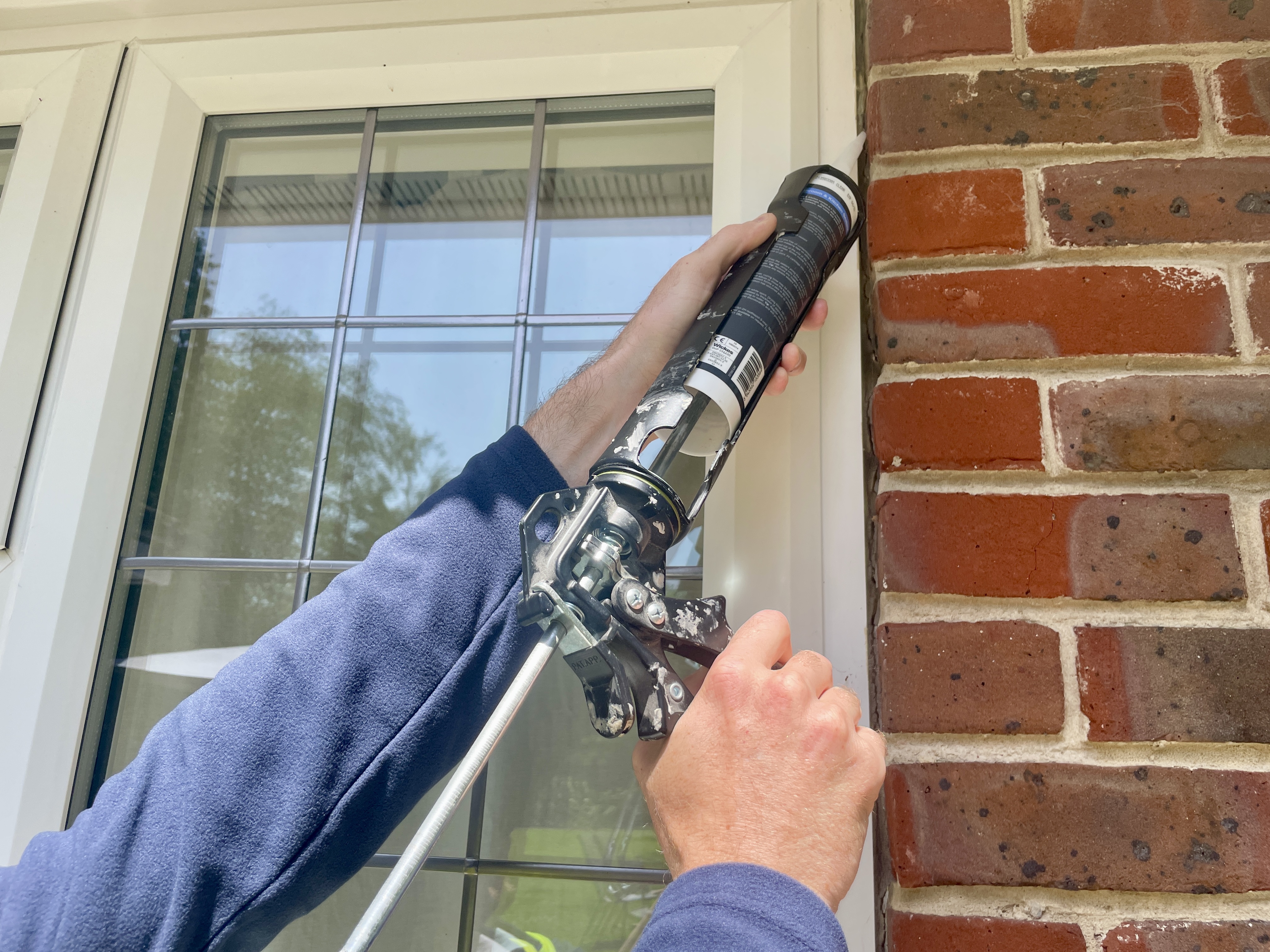 Professional mastic man sealing bathroom